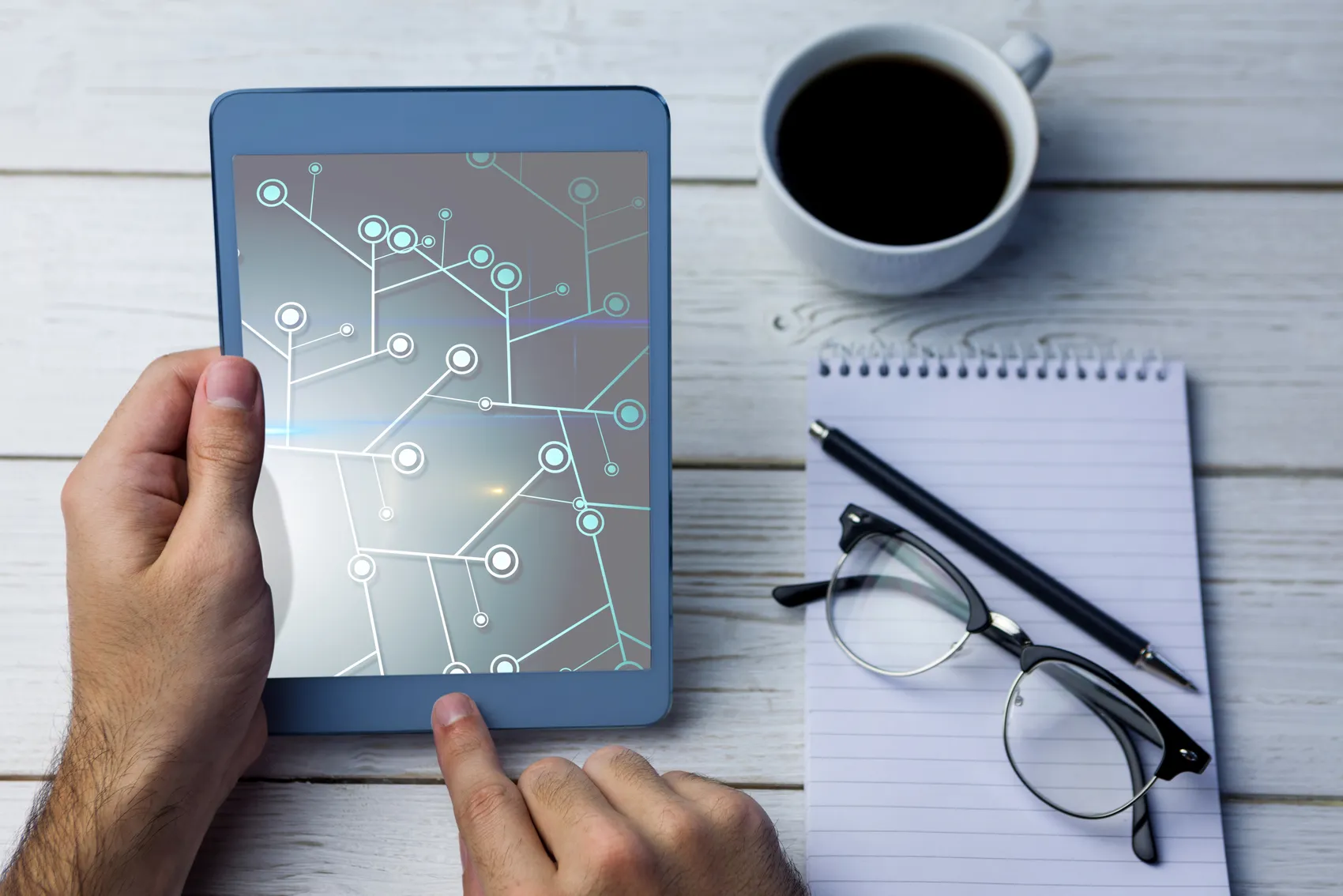 Man Holding Tablet Working With It